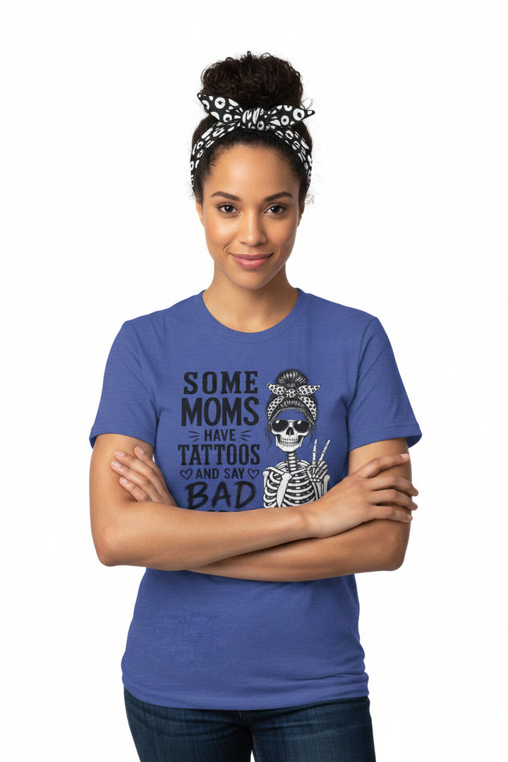 A heather blue short-sleeve t-shirt with a graphic print of a skeleton woman and the text &