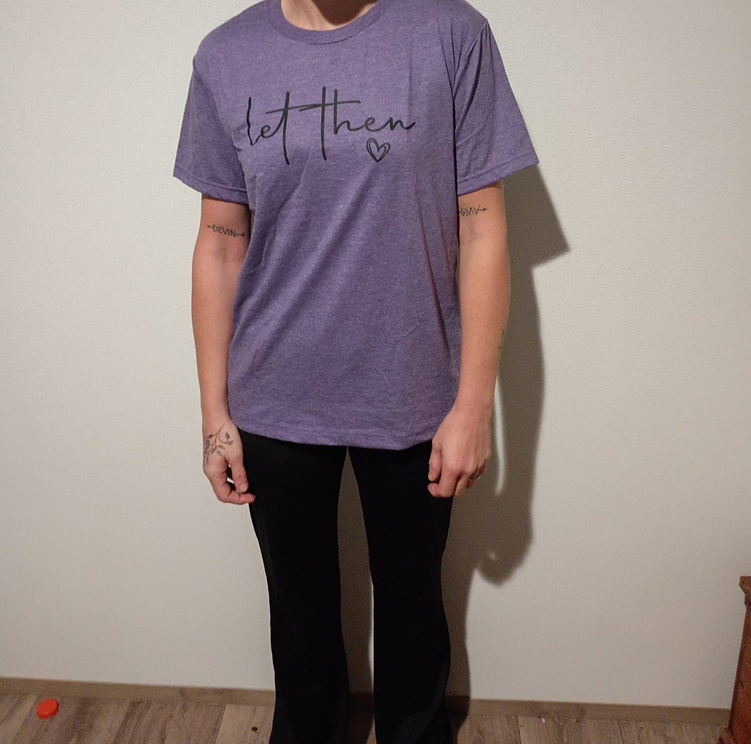Let Them graphic tee shown in heather purple, front view worn
