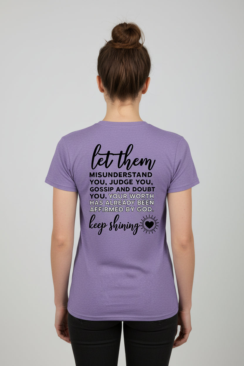 Purple t-shirt with motivational quote on the back against a white background